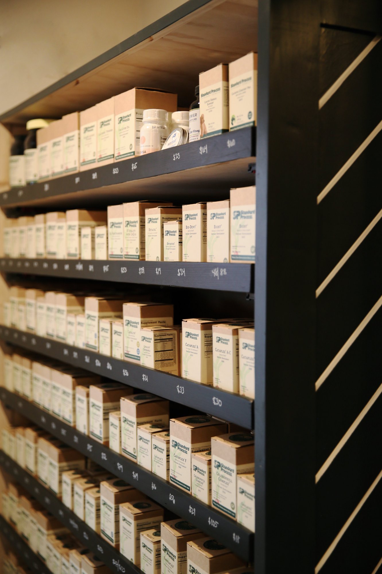 Supplement wall — over 300 products at Infinity Whole Health